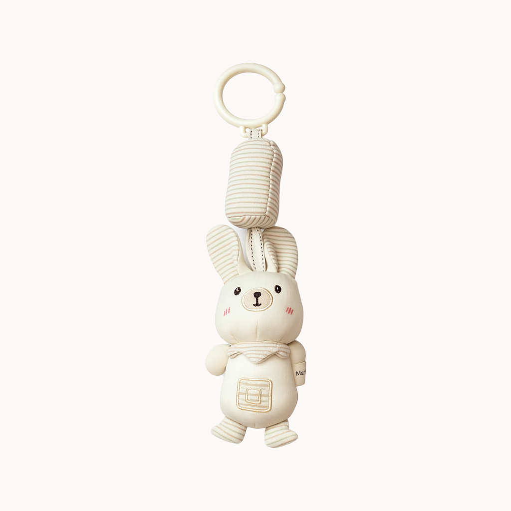 White bunny-shaped keychain with a small tag on a white background