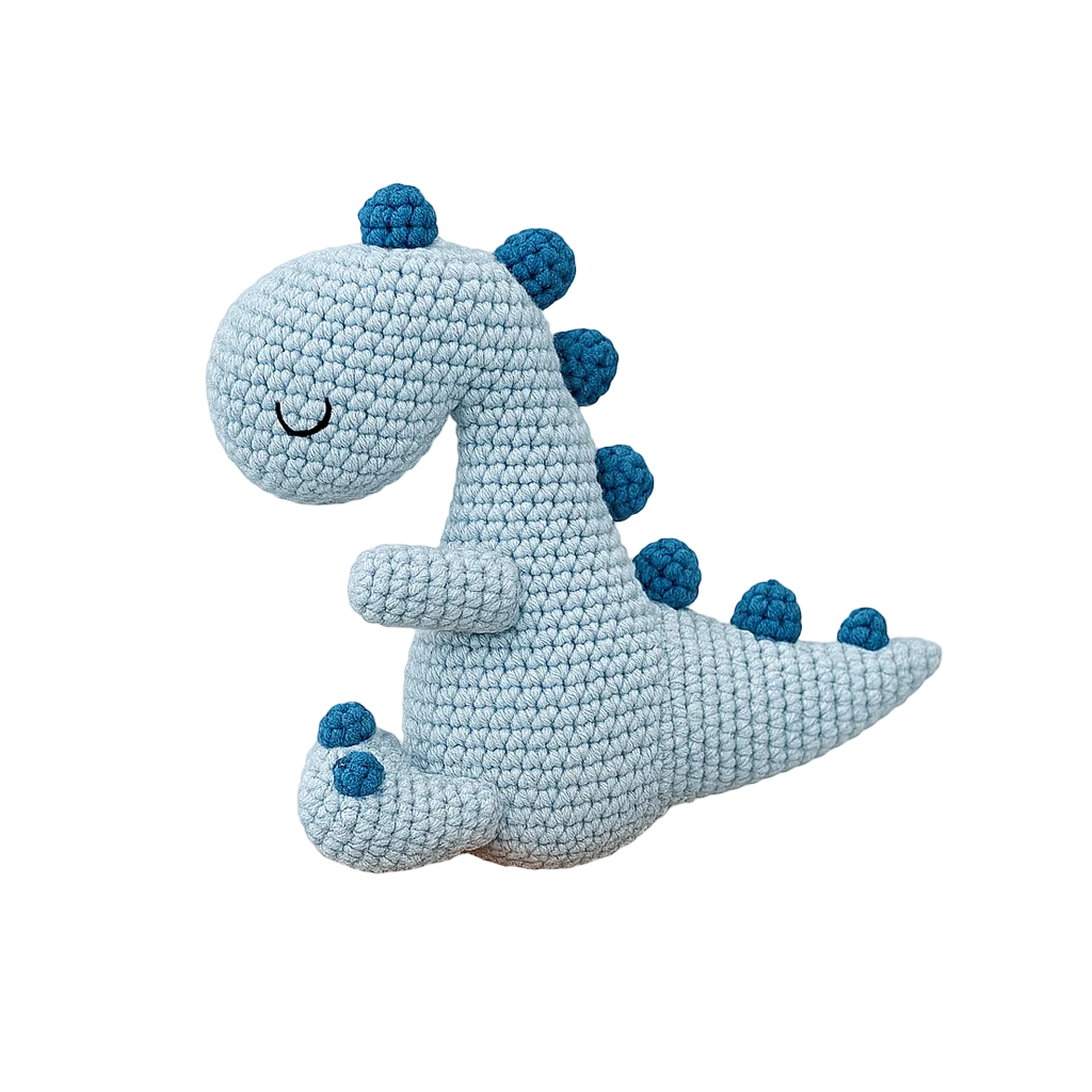 Crocheted dinosaur toy with blue accents on a white background