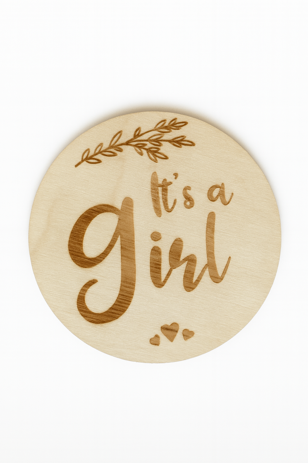 Wooden round sign with 'It's a Girl' text on a white background