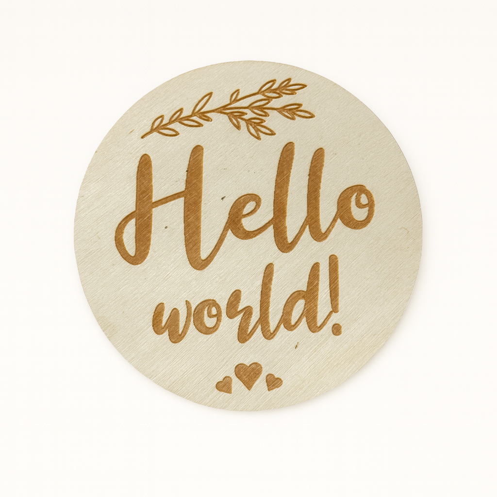 Round beige plaque with 'Hello world!' text and leaf design on a white background
