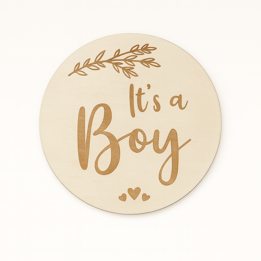 Round wooden sign with 'It's a Boy' text on a white background