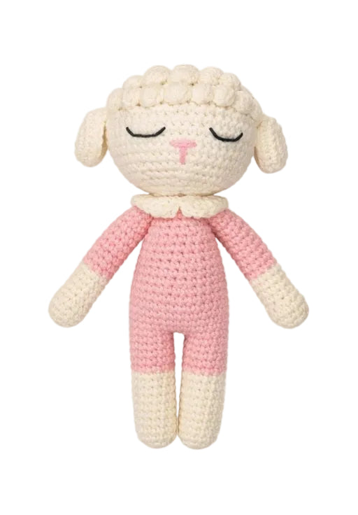 Crocheted toy sheep with pink and white outfit on a white background