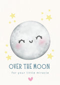 Cartoon moon with a face surrounded by stars and text 'Over the moon for your little miracle' on a light background